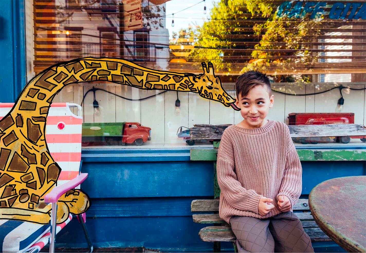 Photo and illustration. One boy sitting on a cafe with a giraffe telling him a secret.