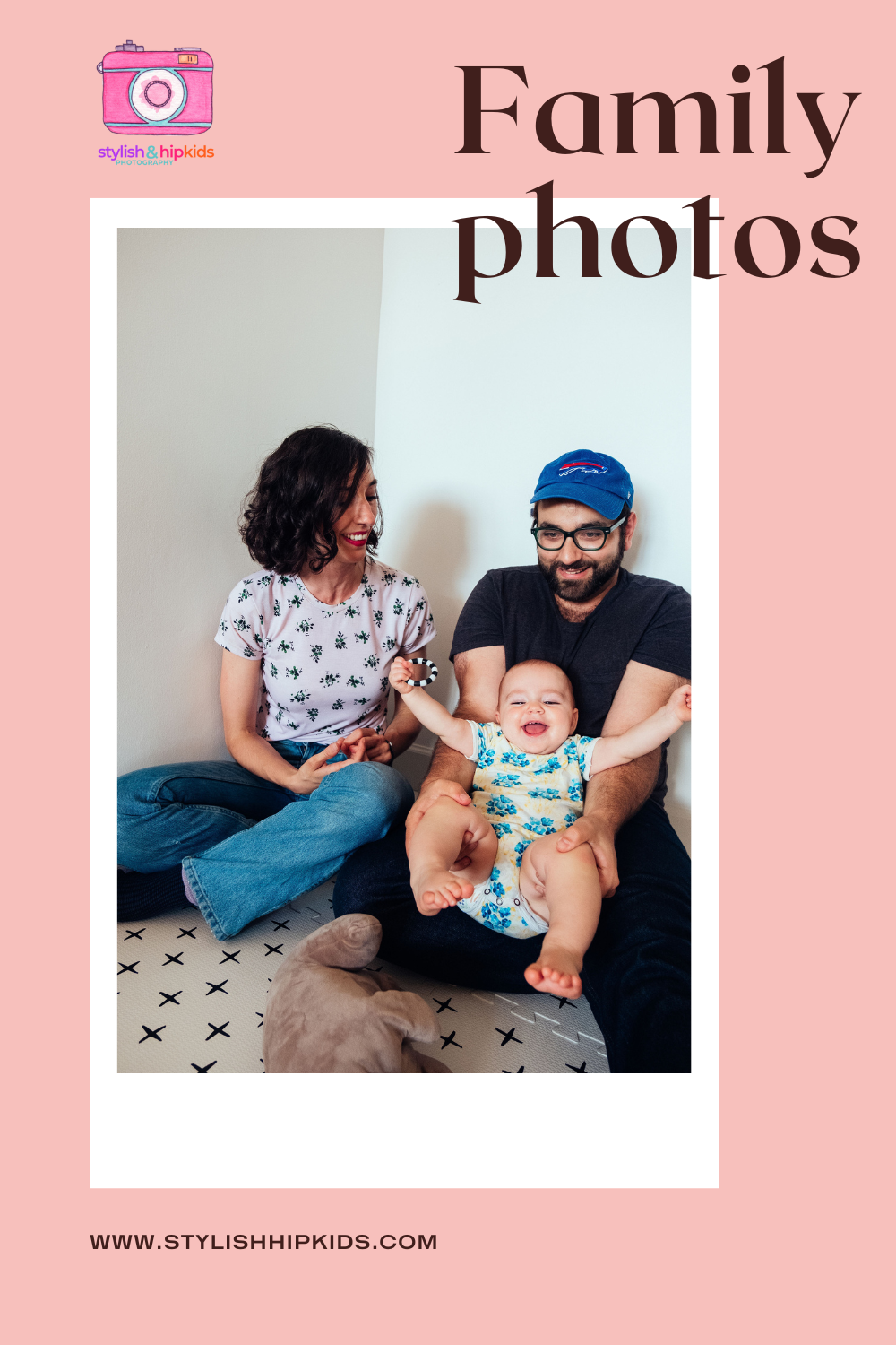 A smiling family sits on the floor; a woman and man flank a laughing baby with outstretched arms. The image, by an NYC family photographer, has a pink border with “Family photos” and a camera logo reading “stylish & hip kids.”.